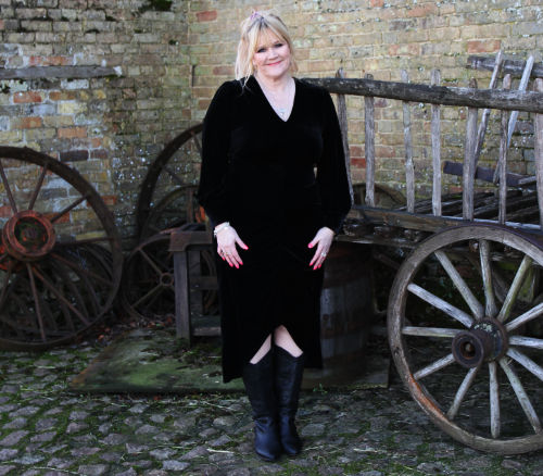 Stella Newman standing outside a farm building